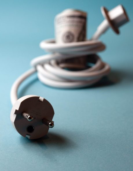 electric-plug-and-dollar-bills-on-blue-background-2025-03-07-13-37-06-utc